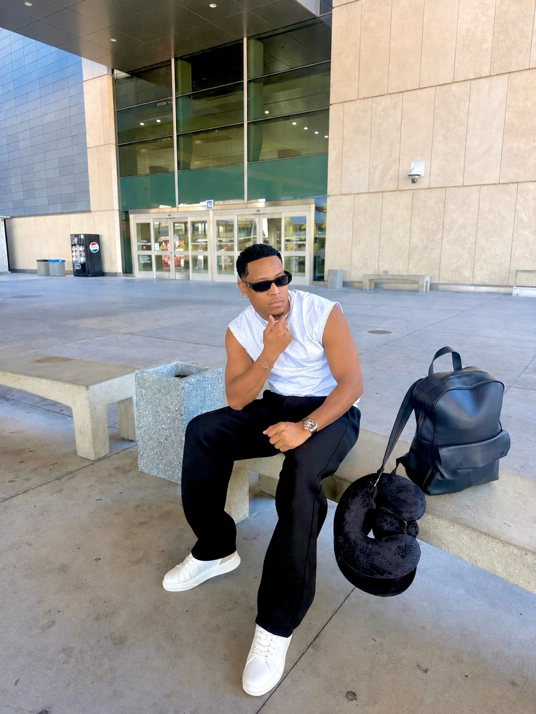 Jemar Lyon in sunglasses outside a modern building in Las Vegas