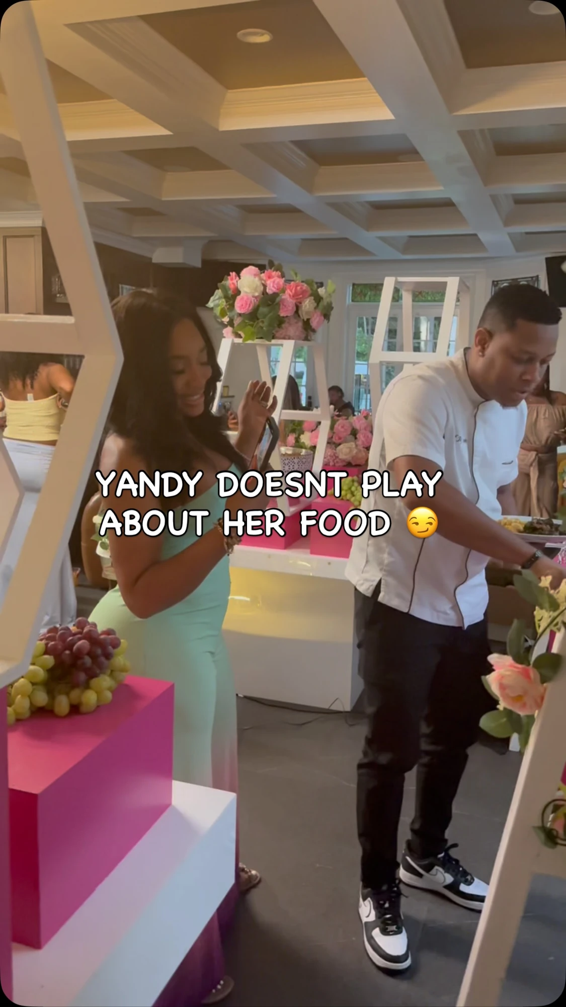 Chef Jay beside a guest at a buffet in the reel tagging @yandysmith